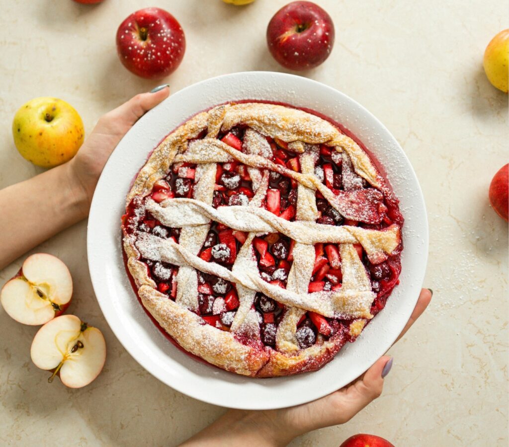 Image SEO example: Mixed berry pie with a woven crust and powedered sugar on top.